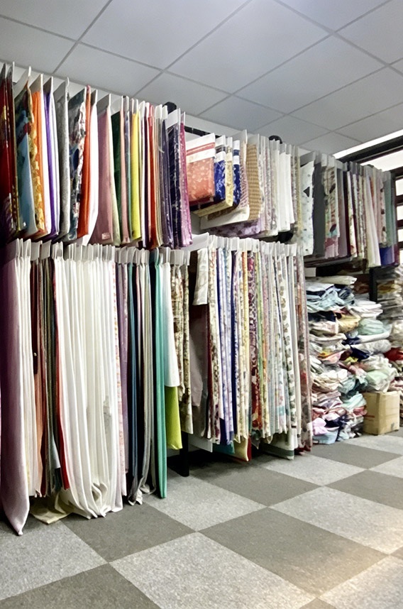 Apparel supply chain system material control, managing fabric sourcing in China's textile hubs for apparel sourcing network and garment production coordination.